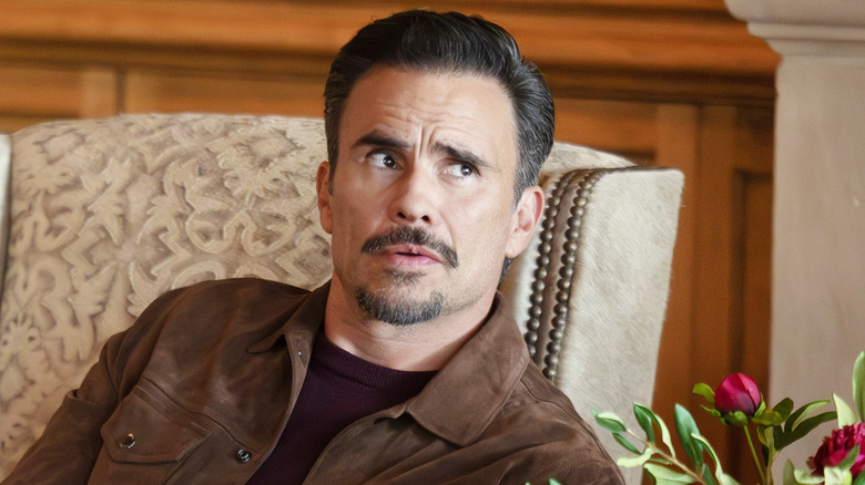 Juan Pablo Raba's Joaquin Reyes sits in a chair in Dutton Ranch