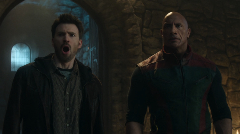 Dwayne Johnson's Callum Drift looks shocked as he stands alongside Chris Evans' Jack O'Malley in Red One
