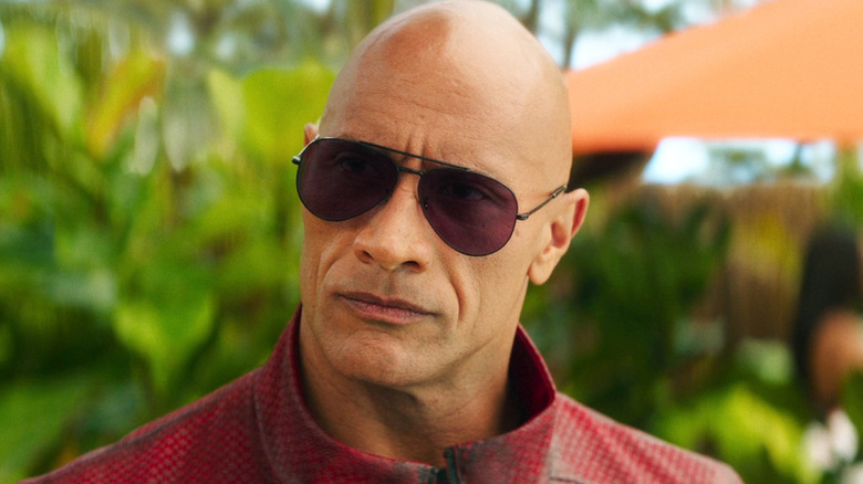 Dwayne Johnson's Callum Drift is seen wearing shades in closeup in Red One