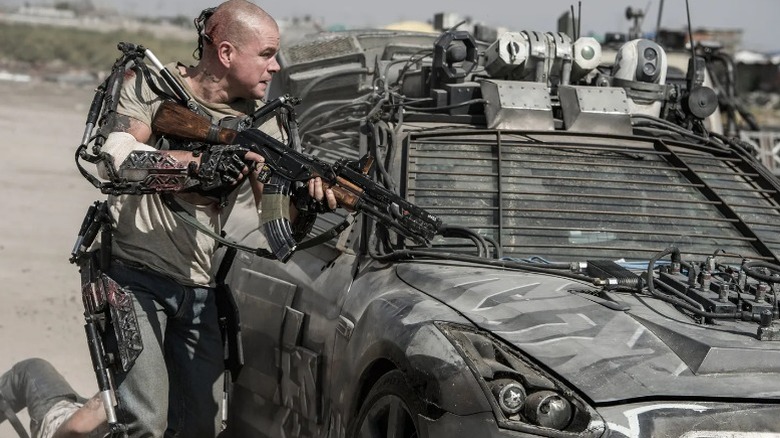 Matt Damon in body mods with gun