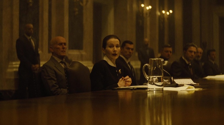 Dr. Vogel sits at big table in Spectre