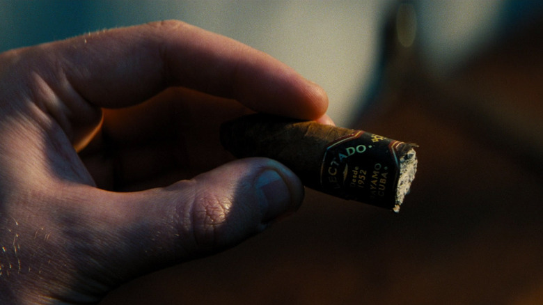 Bond looks at a Delectado Cigar