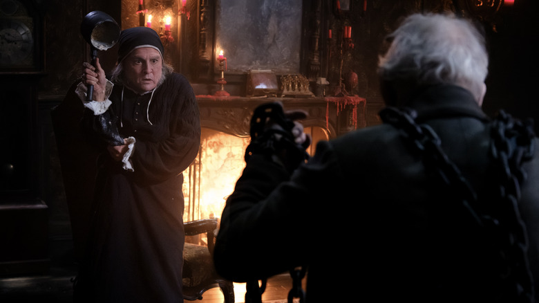 Ebenezer Scrooge (Johnny Depp) is frightened by Jacob Marley (Ian McKellen) in Ebenezer