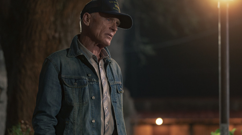 Ed Harris' Everett McKinney stands outside at night in Dutton Ranch