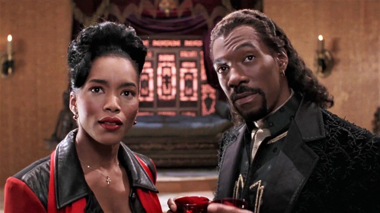 Detective Veder and Maximilian looking at something in Vampire in Brooklyn