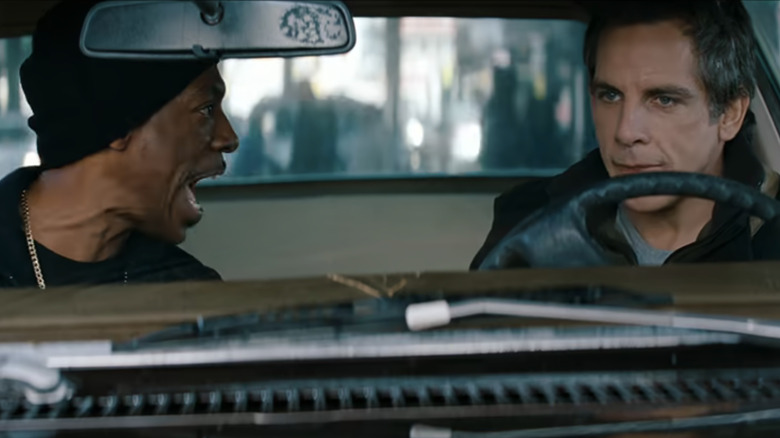Eddie Murphy as Darnell Davis yells at Ben Stiller as Josh Kovaks as they sit in a car in Tower Heist