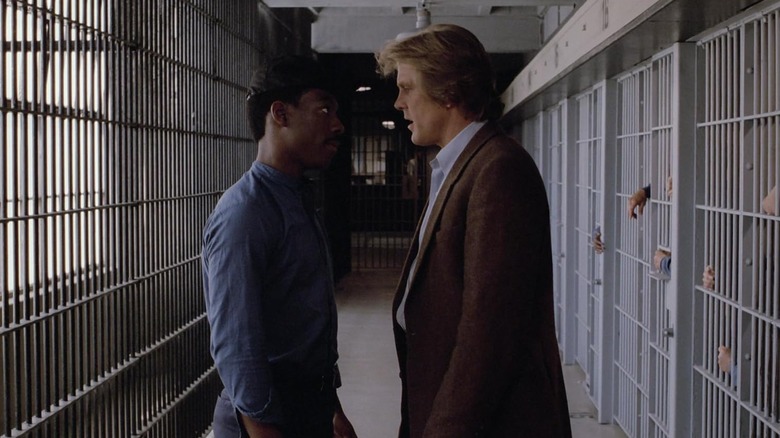 Eddie Murphy as Reggie Hammond and Nick Nolte as Jack Cates square off in a prison in 48 Hours