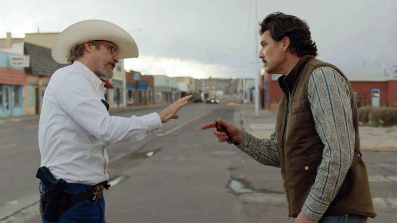 Joe and Ted have an argument in the street in Eddington