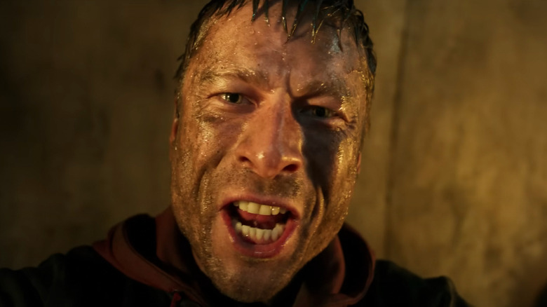 Ben Richards with a dirty face in The Running Man