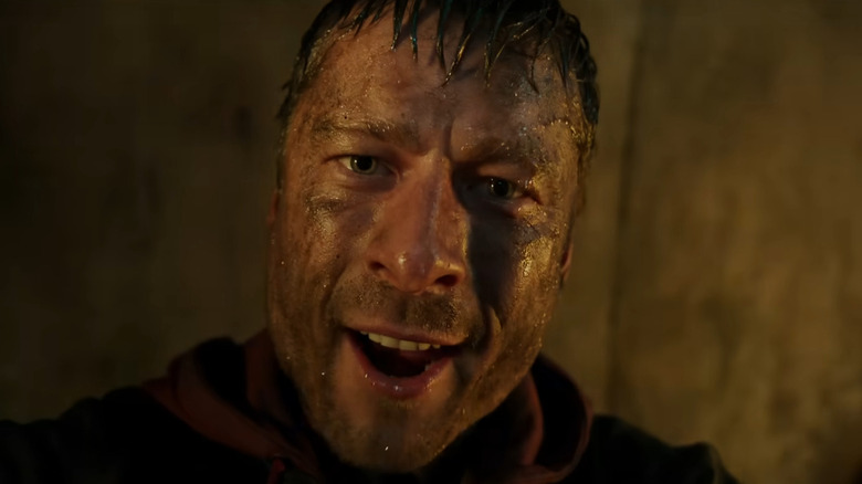 Ben Richards addressing the camera while covered in sewer water in The Running Man