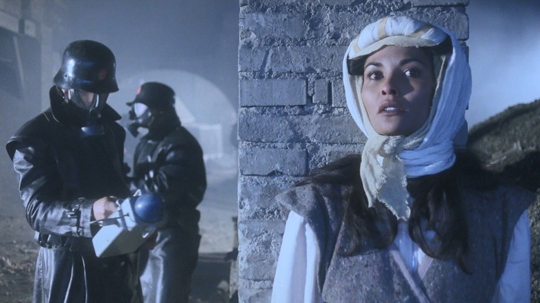 Lilith, hiding out from future soldiers -- holding a stranger scanner -- in the 1983 film Endgame