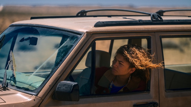 Rue hanging out of a car window on Euphoria