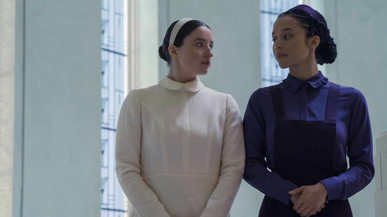Daisy and Agnes looking at each other at the academy on The Testaments
