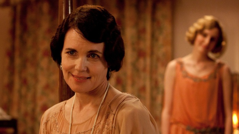 Elizabeth McGovern and Laura Carmichael smiling in Downton Abbey