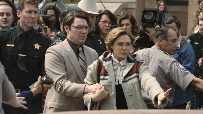 Pat and Candy avoiding the press outside of the courthouse and trying to get into a car in Love & Death