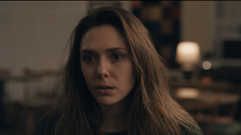 Elizabeth Olsen's Leigh Shaw looks across frame in closeup in Sorry for Your Loss