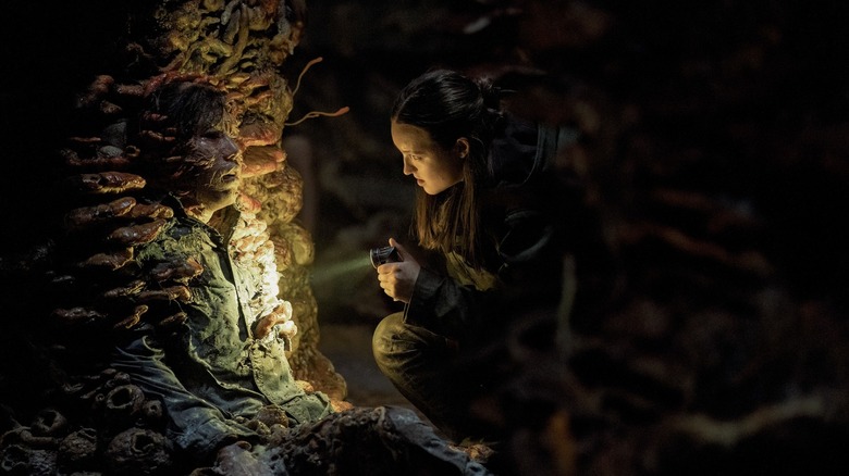 Ellie investigating a cordyceps infected in the dark in The Last of Us season 2