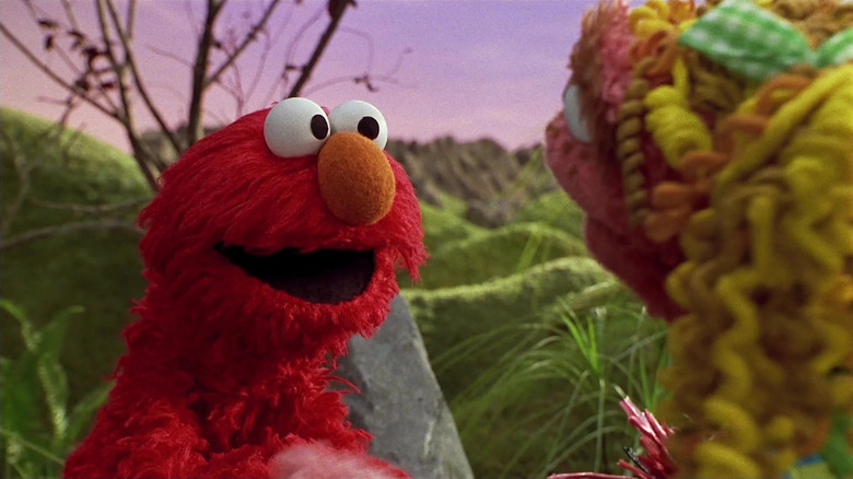 Elmo talking to another Muppet in The Adventures of Elmo in Grouchland