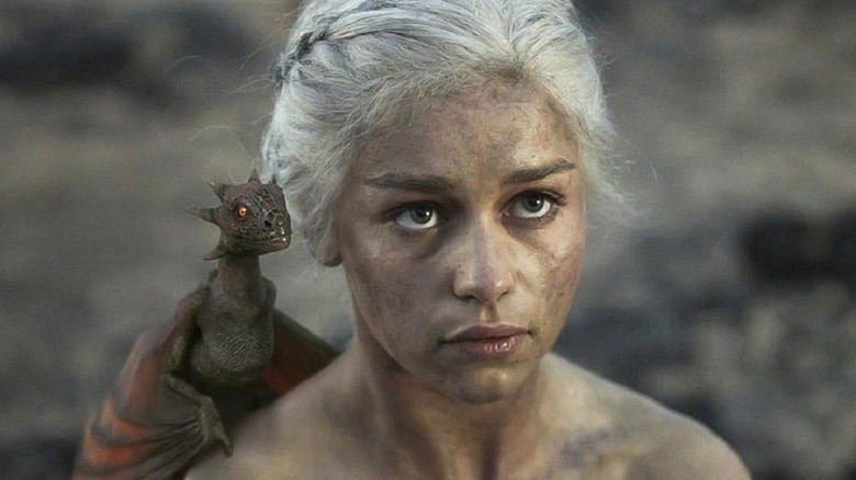 Daenerys with a dragon on her shoulder
