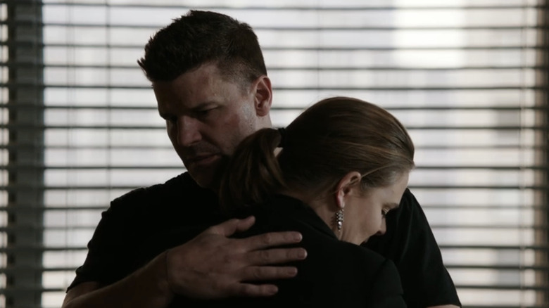 David Boreanaz's Seeley Booth hugs Emily Deschanel's Temperance Brennan in Bones
