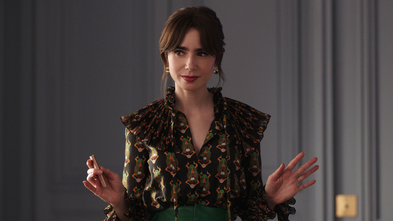 Emily gesturing in Emily in Paris