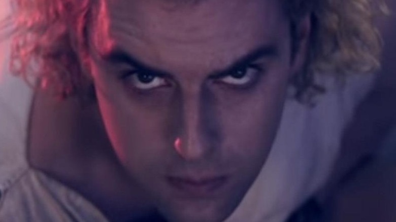 Blonde hero looking determined in close-up