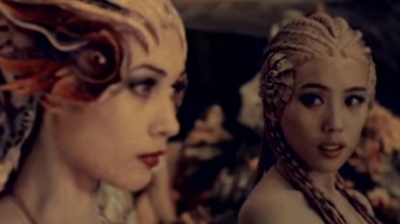 Uncertain mermaids look to each other