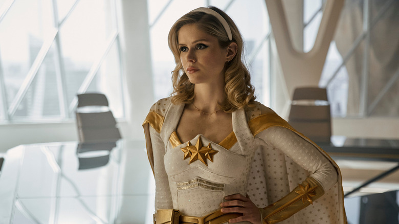 Erin Moriarty as Starlight leaning on a table in The Boys