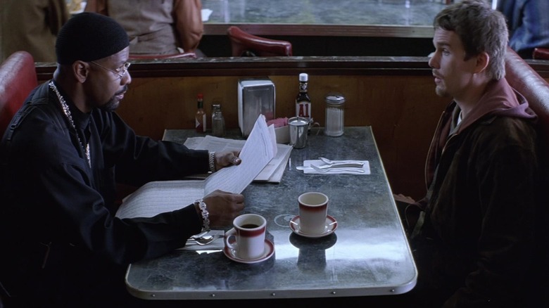 Denzel Washington's Alonzo Harris sits opposite Ethan Hawke's Jake Hoyt in a diner in Training Day