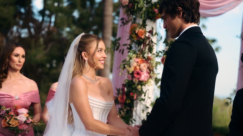 Cassie smiling at Nate during their wedding ceremony on Euphoria