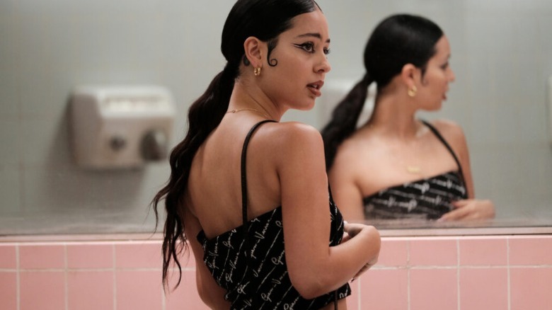 Maddy turned from bathroom mirror