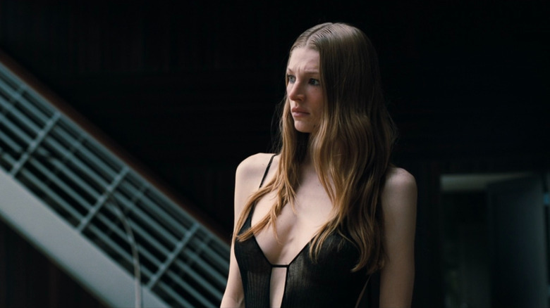 Jules (Hunter Schafer) examining her painting on Euphoria