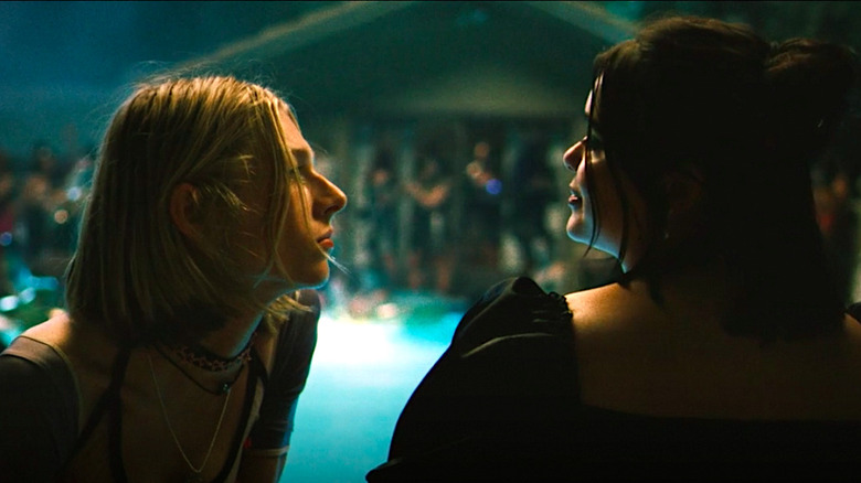 Jules and Kat talk by the pool