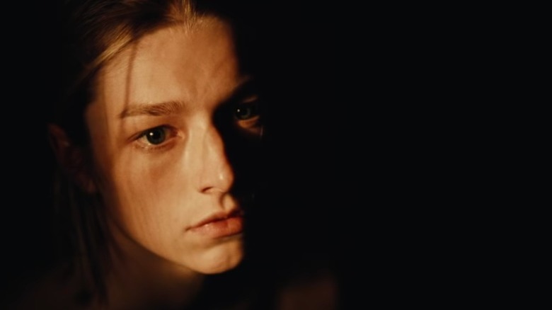 Jules face half in darkness