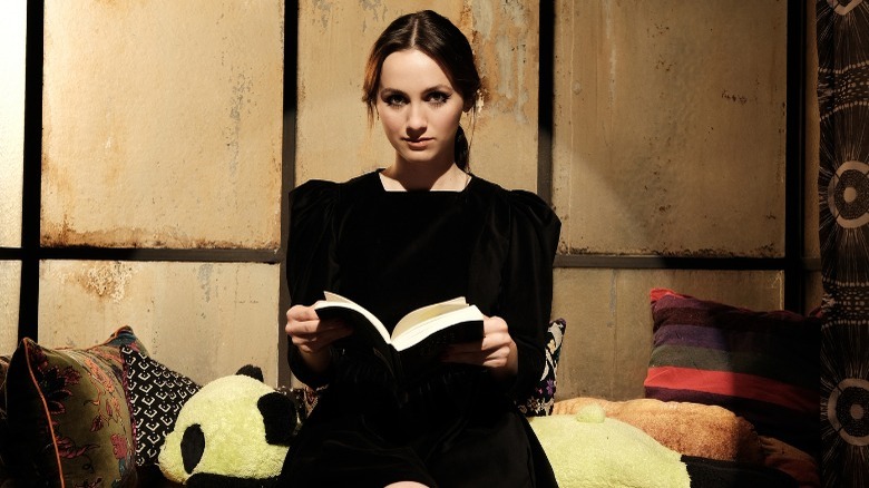 Lexi on stage holding book