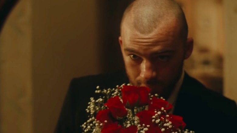 Fez in suit with flowers
