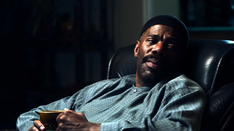 Ali leaning back in a chair in Euphoria