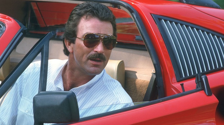 Magnum, sitting in his convertible, wearing shades on Magnum, P.I.