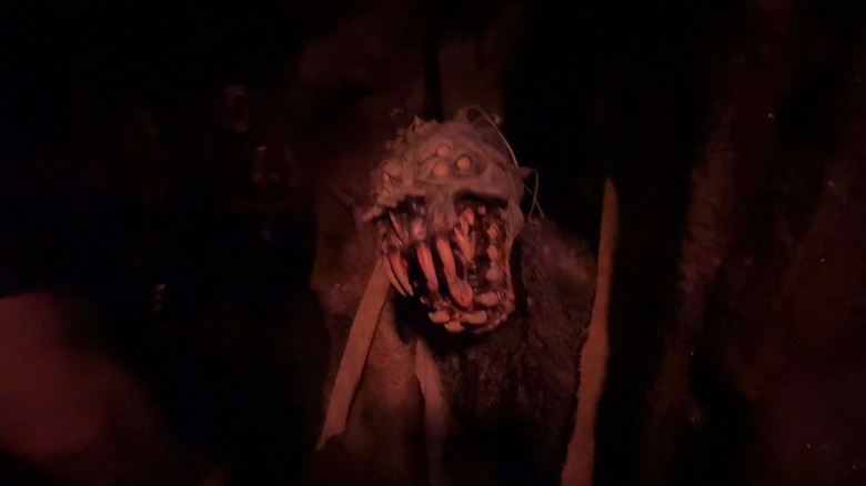 A toothy monster jumps out at Halloween Horror Nights