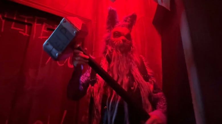A rabbit monster holds a hammer at Halloween Horror Nights