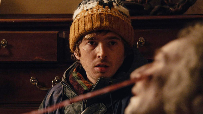 Austin Abrams as Bryan staring in shock at a zombie monster in Resident Evil (2026)