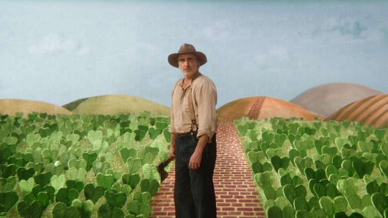 Beau dressed as farmer stands on stage