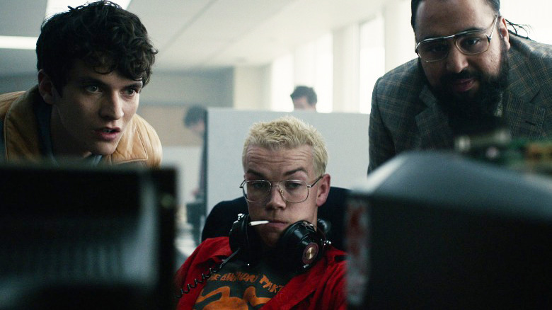 Stefan Butler looking at computer screens Black Mirror
