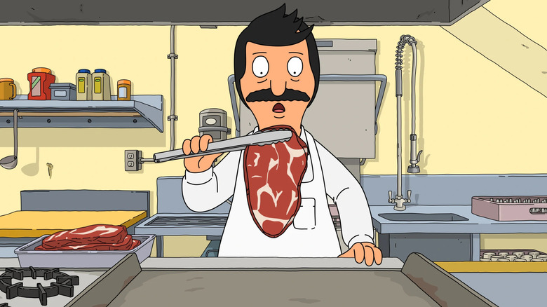 Bob holds a piece of marbled beef