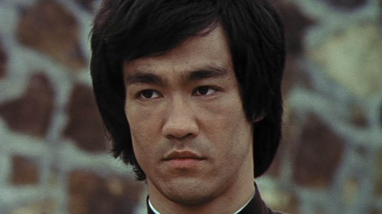 Bruce Lee's Lee looking serious in Enter the Dragon