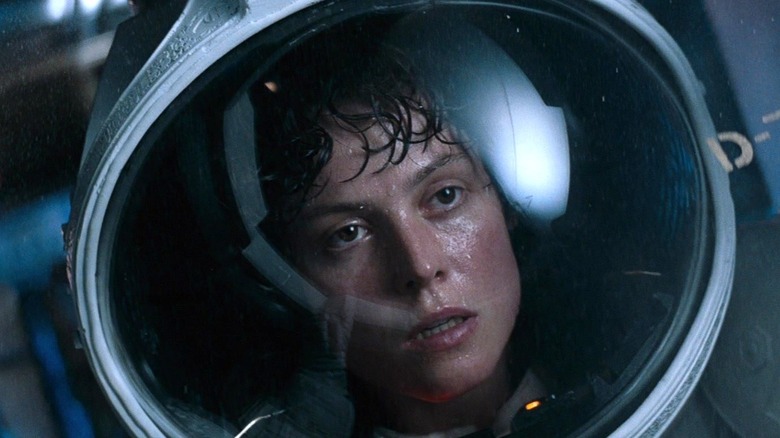 Sigourney Weaver's Ellen Ripley wearing a space helmet in Alien