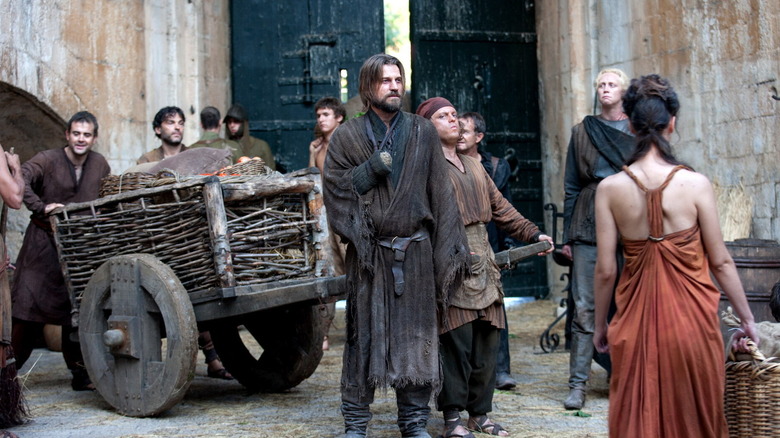Jamie and Brienne standing on a street in King's Landing in Game of Thrones