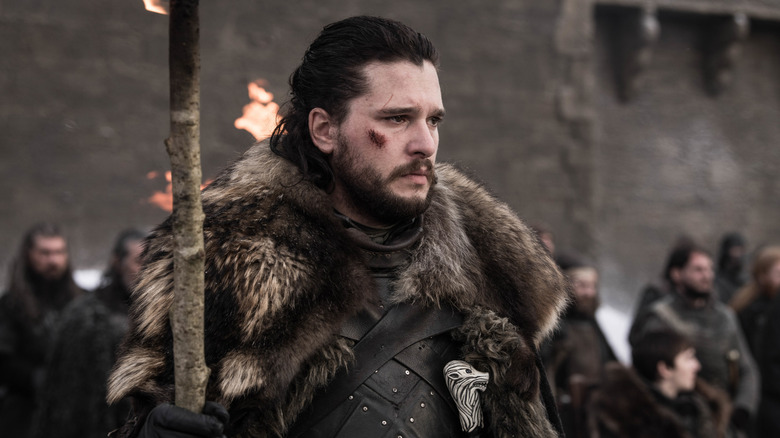 Jon Snow standing before a group at Winterfell in Game of Thrones