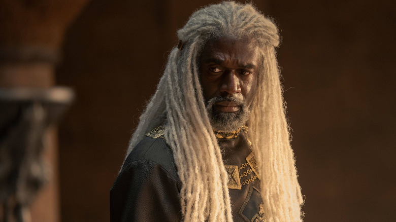 Lord Corlys Velaryon turning his head and looking concerned in House of the Dragon