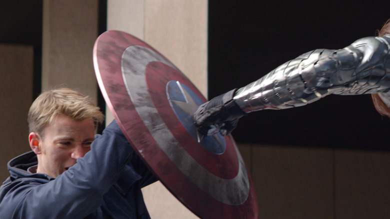 Steve Rogers (Chris Evans) and Bucky Barnes (Sebastian Stan) duel in the streets in Captain America: The Winter Soldier